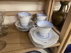 A quantity of early 20th Century tea wares in blue and white with chrome trim