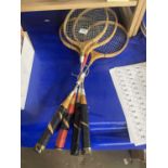 Four badminton rackets