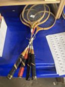 Four badminton rackets