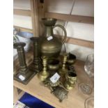 Assorted brass wares to include a pair of dwarf candlesticks, a ewer and others