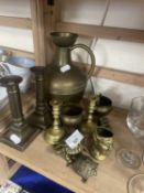 Assorted brass wares to include a pair of dwarf candlesticks, a ewer and others