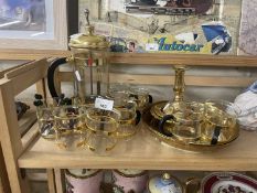 Brass effect cafetiere together with a quantity of matching glass cups, coffee spoons and other