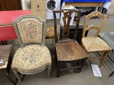 19th Century elm seated dining chair together with a further tapestry covered chair and a rush