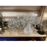 Quantity of mixed drinking glasses and a small decanter