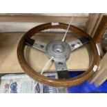 A Mountney wooden and chromed steering wheel