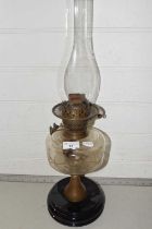 A vintage oil lamp with glass font