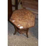 A early 20th Century carved floral hexagonal table