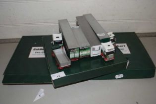 A collection of Eddie Stobart toy lorries and related items