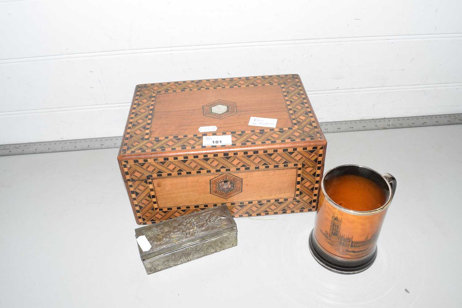 An inlaid jewellery box together with a further small base metal box and a ceramic tankard (3)