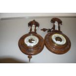 Two late 19th or early 20th Century walnut cased barometers with carved decoration