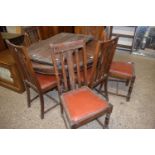 Early 20th Century oak extending dining table together with a set of six slap back chairs (7)