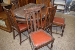 Early 20th Century oak extending dining table together with a set of six slap back chairs (7)