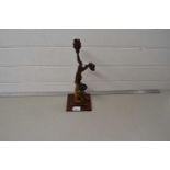 A Art Deco style figural table lamp on a metal table lamp base