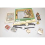 Mixed Lot: Various wrist watches, military cap badges, cigarette case, an enamel desk clip and other