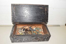 A small wooden box containing a quantity of costume jewellery