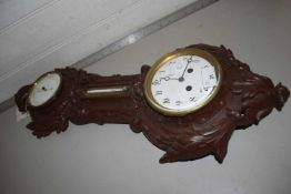 An unusual combination clock, barometer and thermometer in a cast iron frame