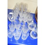 A collection of various cut glass drinking glasses