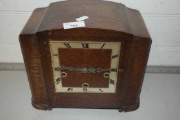 An early 20th Century oak cased mantel clock