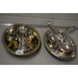 Silver serving dish and a range of various cutlery