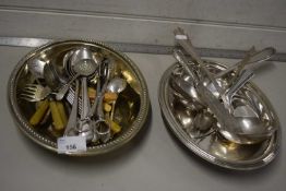 Silver serving dish and a range of various cutlery