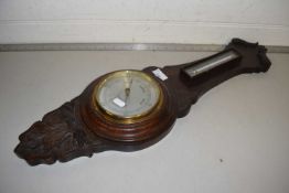 An oak cased barometer