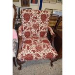 Georgian style floral upholstered armchair on carved scrolled legs