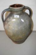 Large terracotta double handled jar with pouring lip