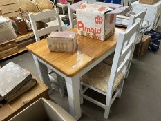 Pine kitchen table with white painted legs together with four dining chairs with rush seats