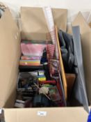 One box of various photograph albums, highlighter pens, binoculars, and other assorted house