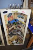 Motoring interest - a corner cabinet decorated with motoring ephemera toether with shelf contents of