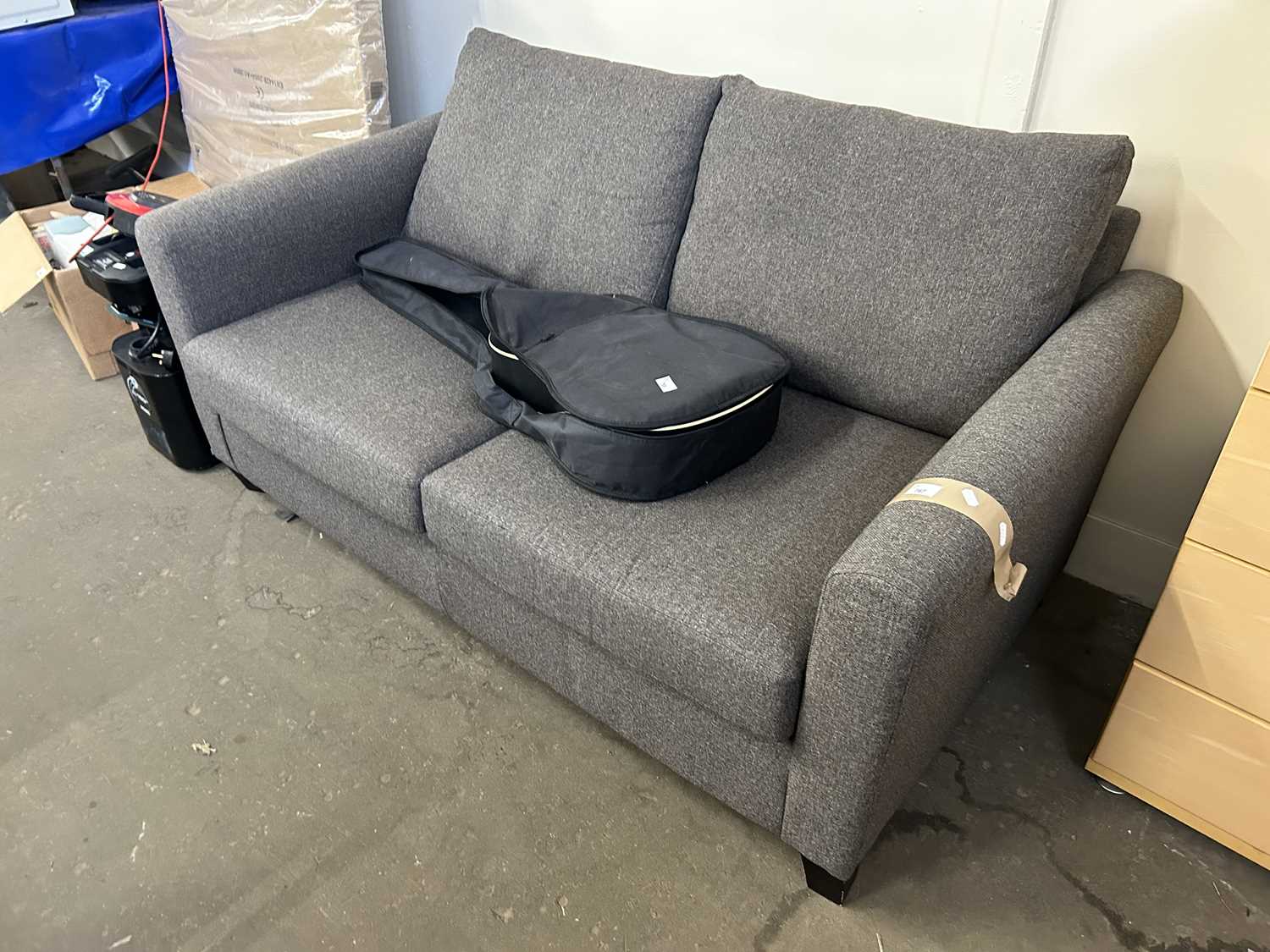 A grey upholstered two seater sofa, approx 160cm wide