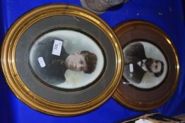 Two oval photographic portraits of a lady and gentleman in oval gilt frames