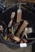 Bucket of assorted workshop tools