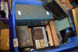 Box containing various vintage tins, brass weights