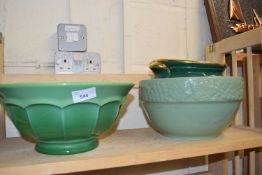A large green glass bowl together with a green glazed Portuguese pottery bowl and a green and gilt