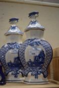 Pair of blue and white delft style vases and covers