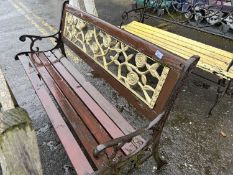 Iron and wood garden bench with rose decorated back and slatted seat, 125cm wide