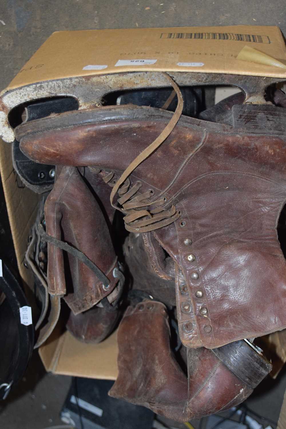 Box of vintage ice skates