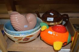 A quantity of mixed ceramics to include teapot, novelty airplane moneybox and others
