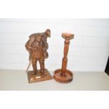 20th Century carved wooden model of a shepherd together with a turned wooden stand (2)