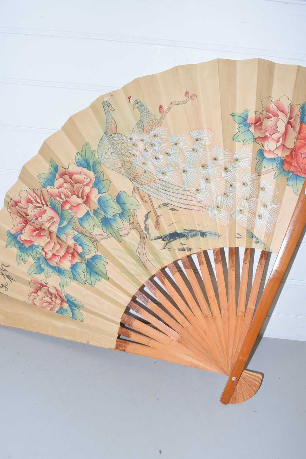 Large Chinese fan decorated with two peacocks