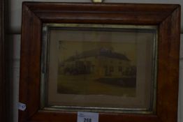 Original sepia photograph of a country house in wooden frame, glazed