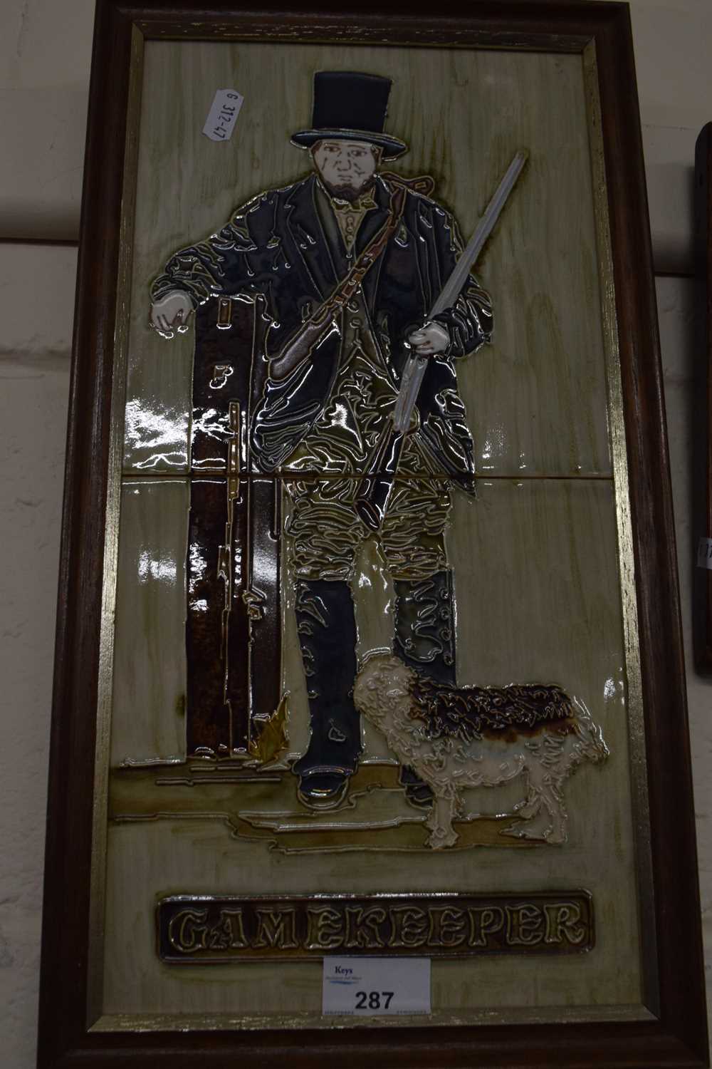 Tiled plaque of The Gamekeeper, framed