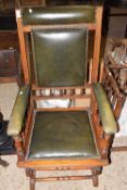 Late 19th Century American rocking chair with green leather upholstery