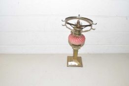 Small brass based oil lamp with glass font, lacking shade