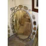 Large modern oval bevelled wall mirror in metal frame, 128cm wide