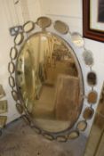 Large modern oval bevelled wall mirror in metal frame, 128cm wide