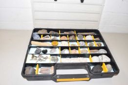 Large plastic case containing various assorted fossils and mineral samples
