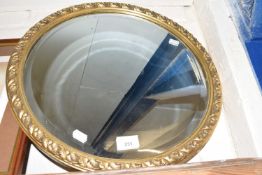 Circular wall mirror in gilt frame