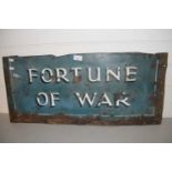 A cut down painted metal sign marked 'Fortune of War'